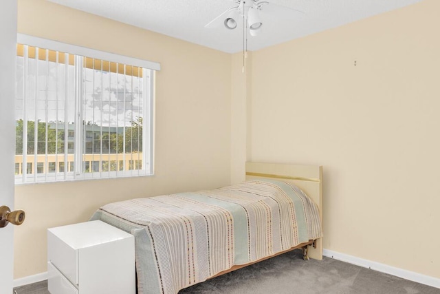 bedroom featuring carpet flooring and baseboards