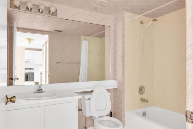 bathroom with toilet, wallpapered walls, shower / bath combination with curtain, and vanity