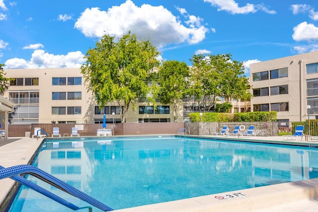 pool featuring fence