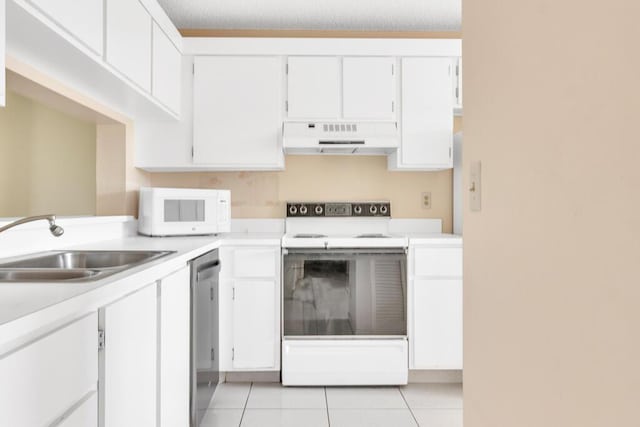 kitchen featuring light tile patterned floors, white appliances, light countertops, under cabinet range hood, and a sink