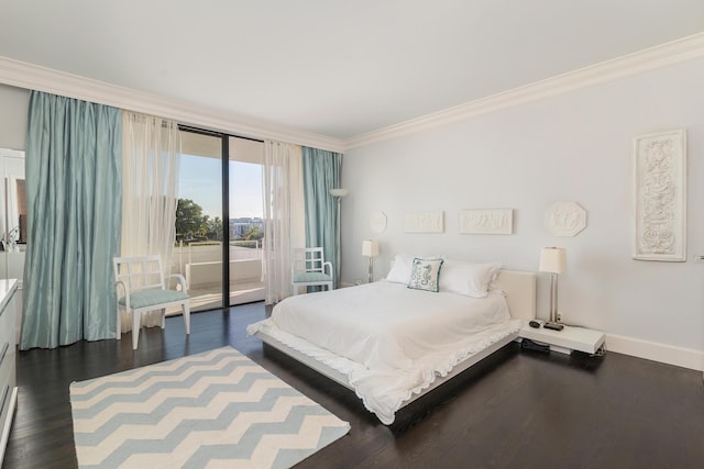 bedroom featuring access to outside, ornamental molding, dark wood-type flooring, and baseboards