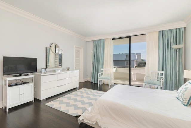 bedroom featuring baseboards, ornamental molding, dark wood finished floors, and access to exterior