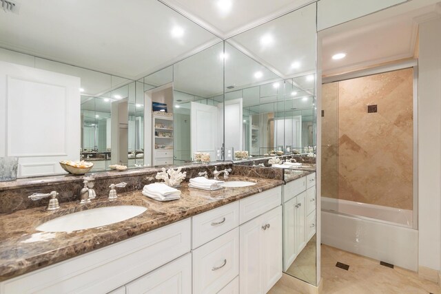 bathroom featuring a raised ceiling, sink, an enclosed shower, and tile patterned floors