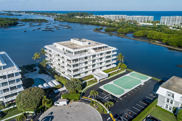 birds eye view of property with a water view