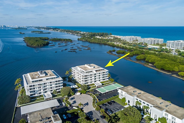 birds eye view of property with a water view