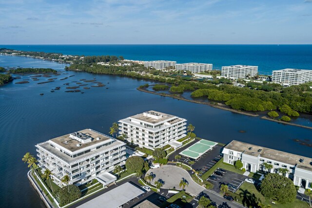 birds eye view of property with a water view