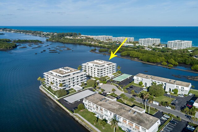 birds eye view of property with a water view