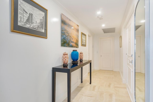 hall featuring visible vents and baseboards