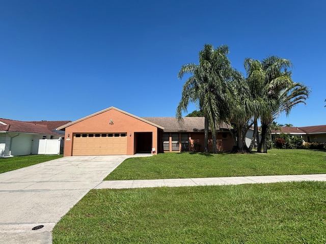 single story home with a garage and a front yard