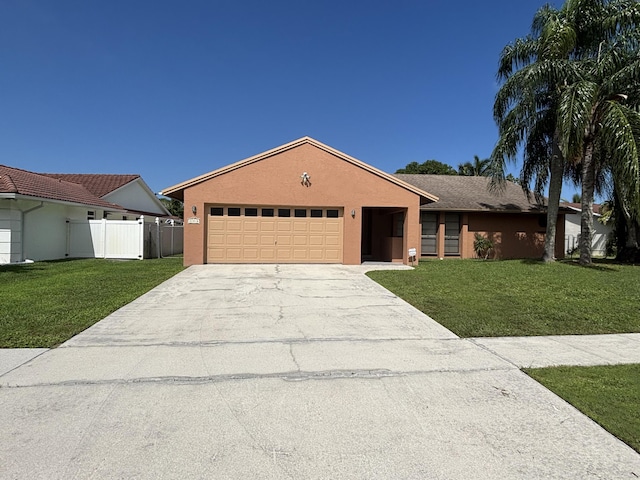 single story home featuring a garage and a front lawn