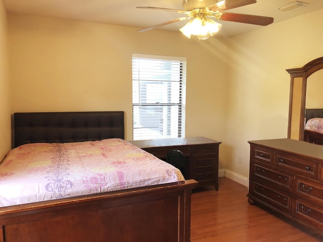 bedroom with hardwood / wood-style floors and ceiling fan