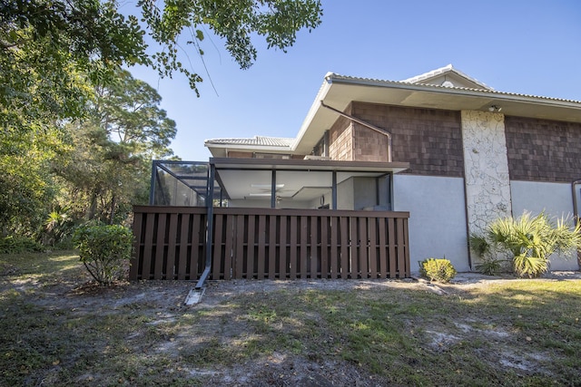 rear view of property with a yard