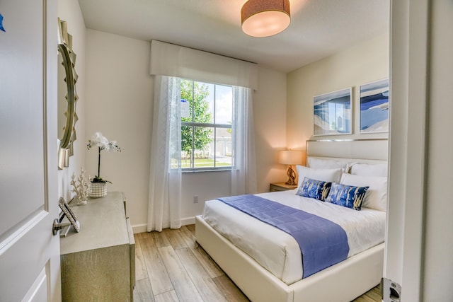 bedroom with light wood-type flooring