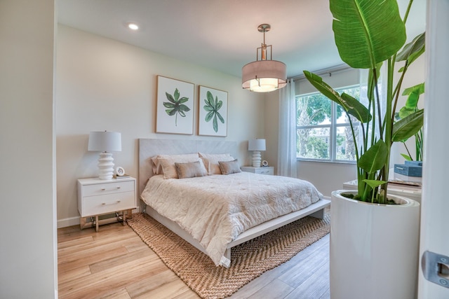 bedroom with light hardwood / wood-style floors