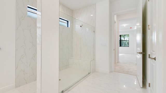 bathroom featuring tiled shower