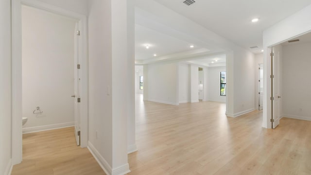 corridor featuring light hardwood / wood-style floors