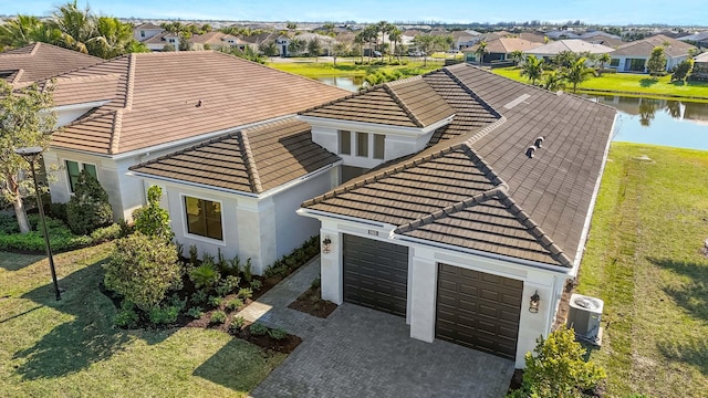 birds eye view of property featuring a water view