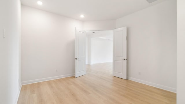 spare room with light wood-type flooring