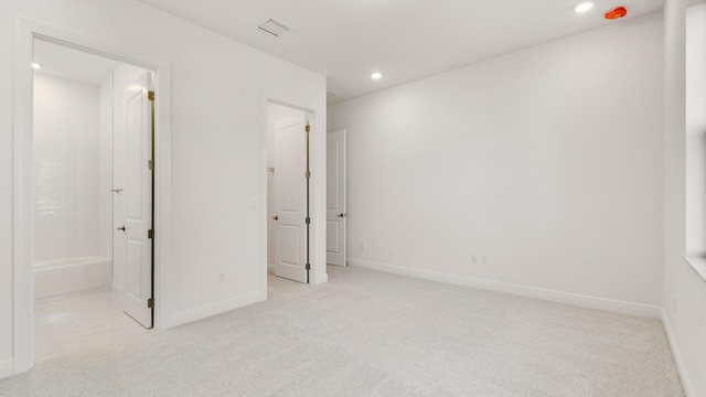 unfurnished bedroom featuring light colored carpet