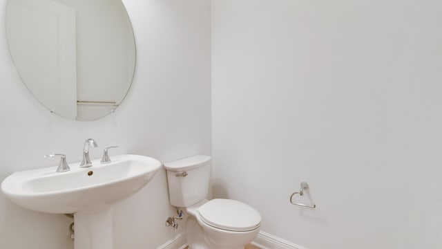 bathroom featuring sink and toilet