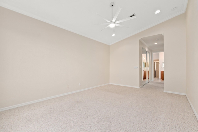 spare room with ornamental molding, light carpet, and ceiling fan