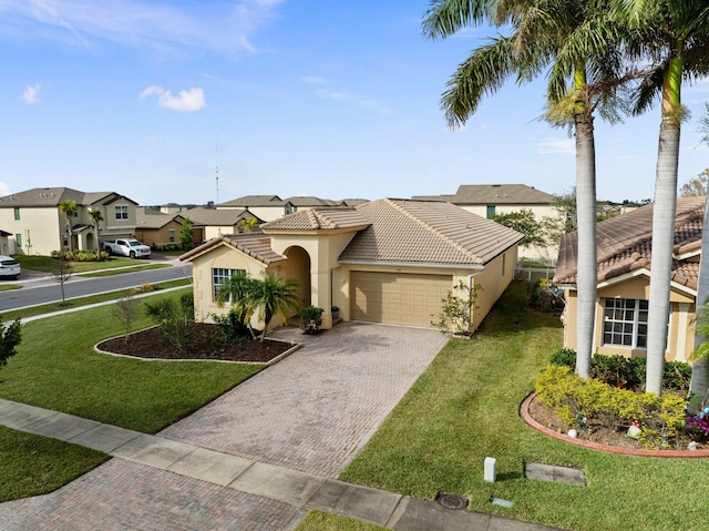 mediterranean / spanish-style home featuring a garage and a front lawn