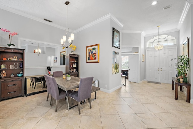 tiled dining space with crown molding and a chandelier