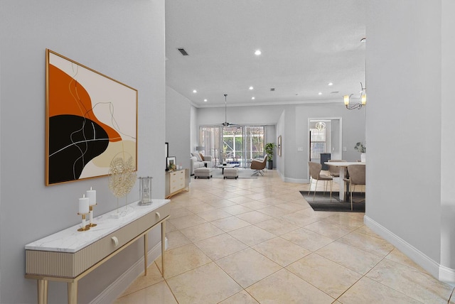 interior space with visible vents, crown molding, baseboards, recessed lighting, and light tile patterned flooring