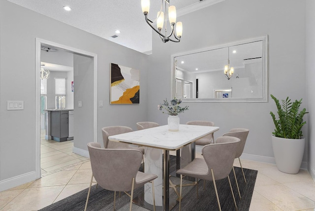 dining area featuring visible vents, a notable chandelier, light tile patterned flooring, and baseboards