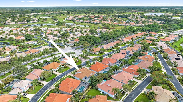 aerial view with a residential view and a water view