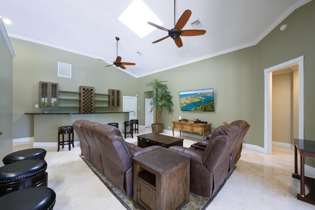 living room with crown molding, ceiling fan, and lofted ceiling with skylight