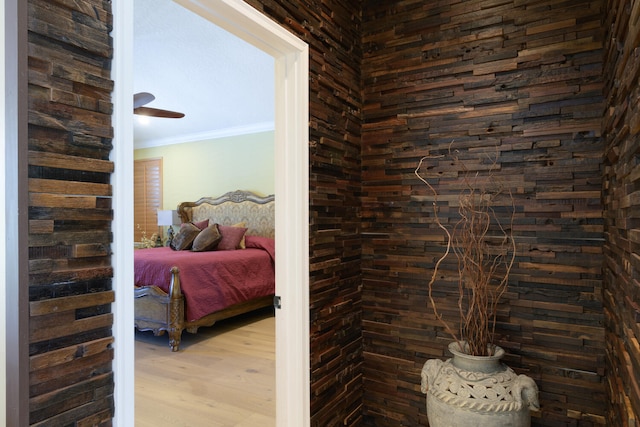 interior space featuring crown molding and light hardwood / wood-style floors