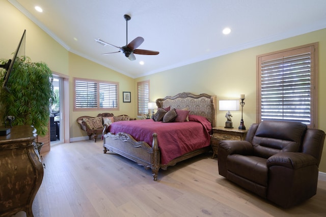 bedroom with crown molding, ceiling fan, lofted ceiling, and light hardwood / wood-style floors