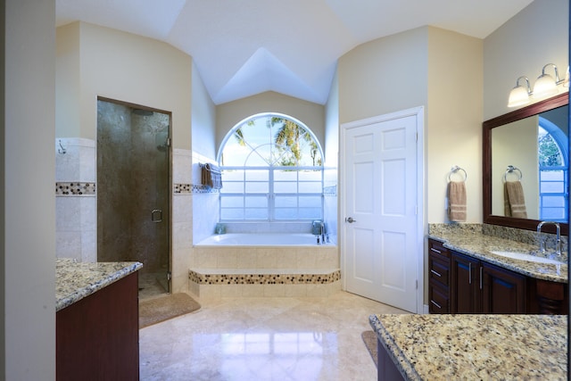 bathroom featuring lofted ceiling, vanity, and shower with separate bathtub