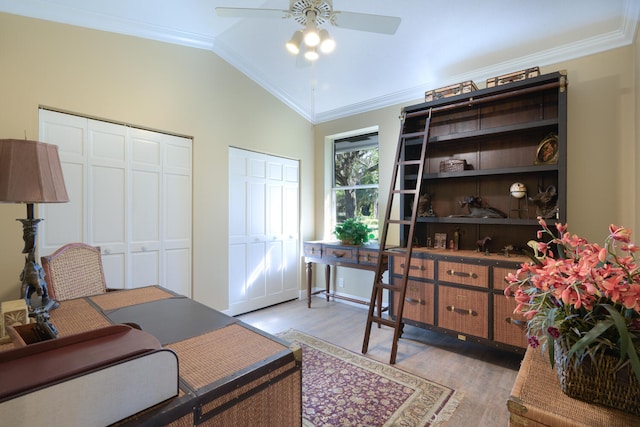 office area with crown molding, ceiling fan, vaulted ceiling, and hardwood / wood-style flooring