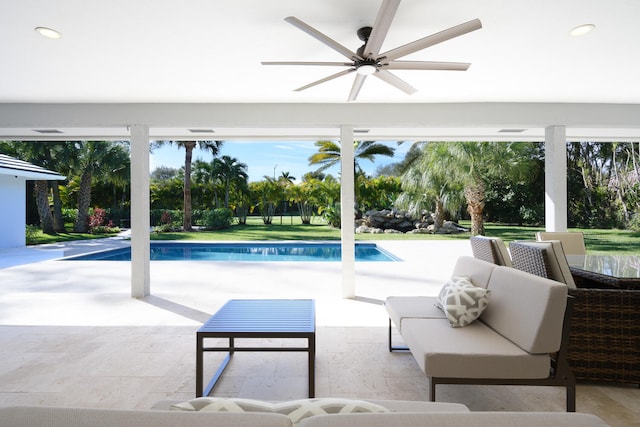 view of pool with a patio area and ceiling fan