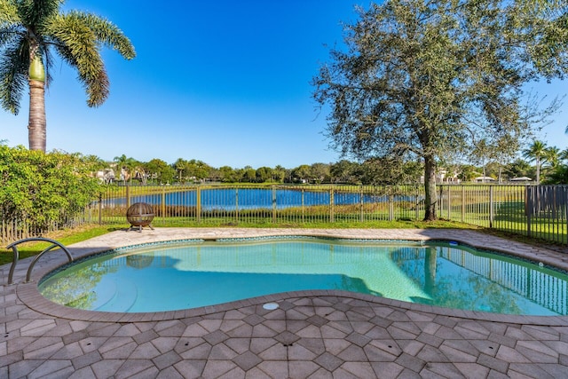 view of swimming pool with a water view