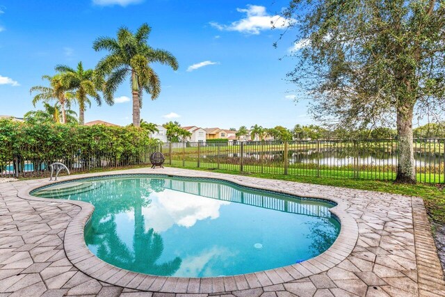 rear view of property with a fenced in pool, a patio, an outdoor hangout area, and ceiling fan