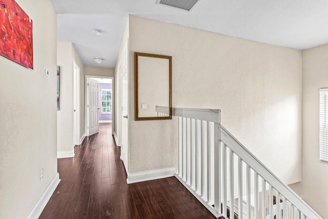 hallway with dark hardwood / wood-style floors