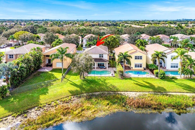 birds eye view of property featuring a water view