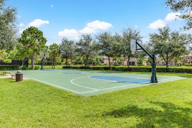 view of basketball court featuring a yard