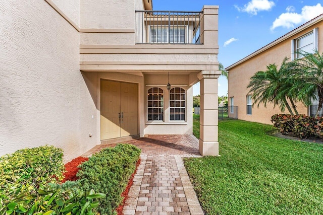 property entrance with a yard