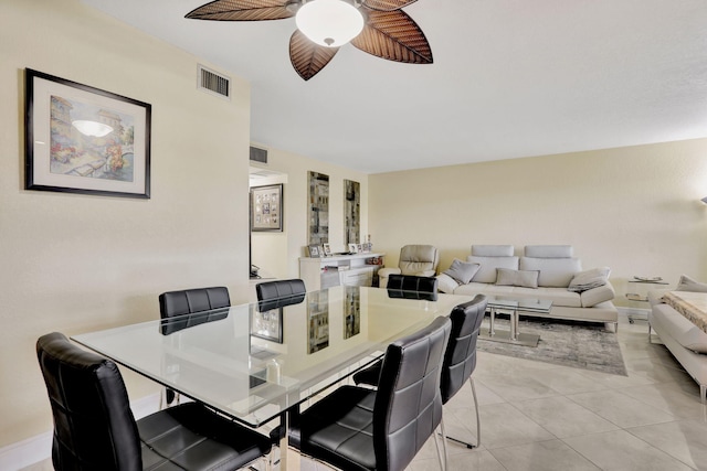 dining area featuring ceiling fan and light tile patterned flooring