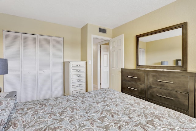 bedroom featuring a closet and a textured ceiling