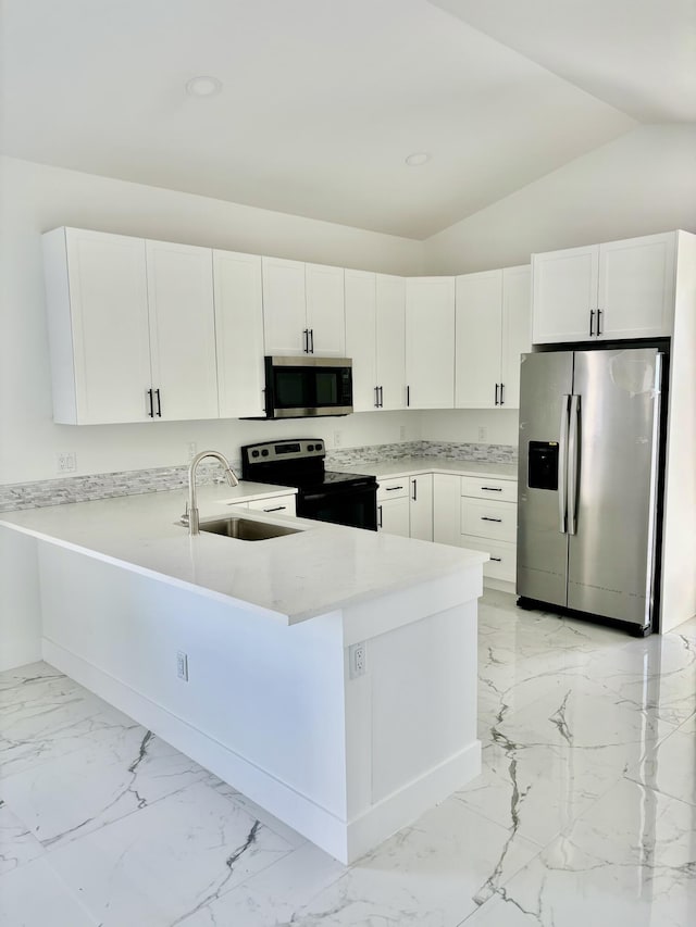 kitchen featuring white cabinetry, appliances with stainless steel finishes, sink, and kitchen peninsula