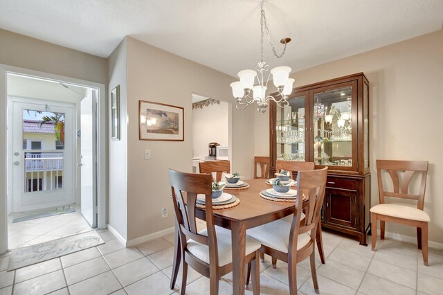 kitchen featuring sink, light tile patterned floors, and white appliances