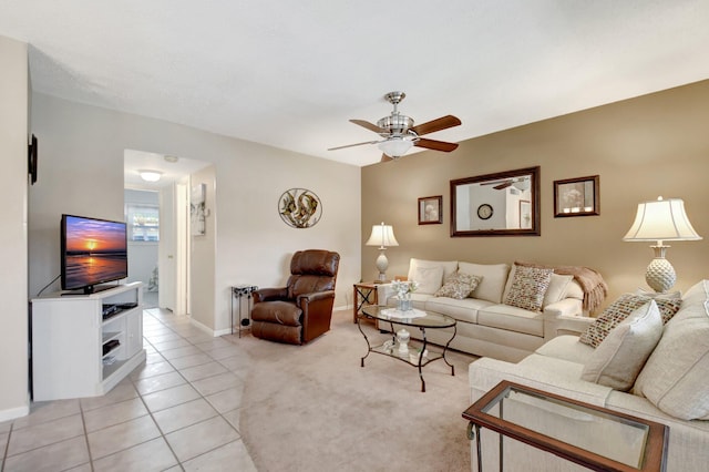 tiled living room featuring ceiling fan