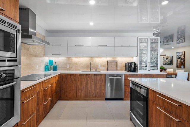 kitchen featuring white cabinetry, wall chimney range hood, wine cooler, and appliances with stainless steel finishes