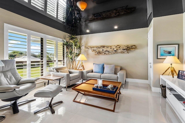 living room with a high ceiling