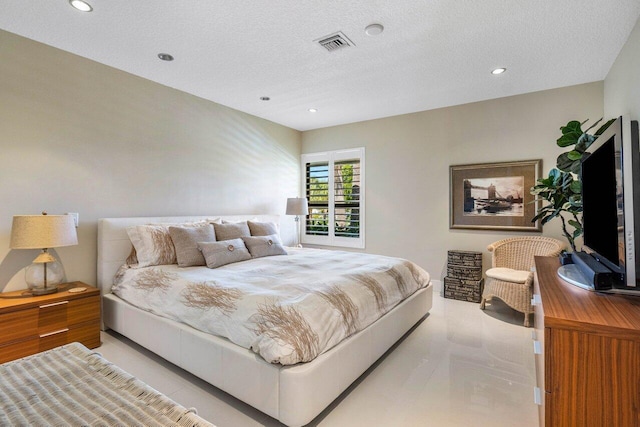 bedroom featuring a textured ceiling